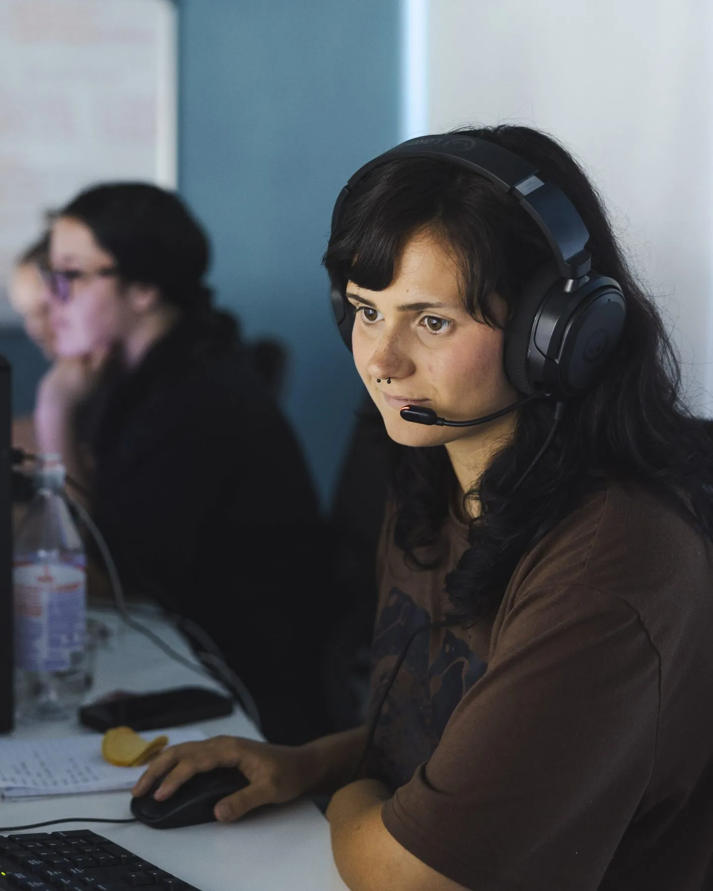 A call-centre agent taking a booking by phone