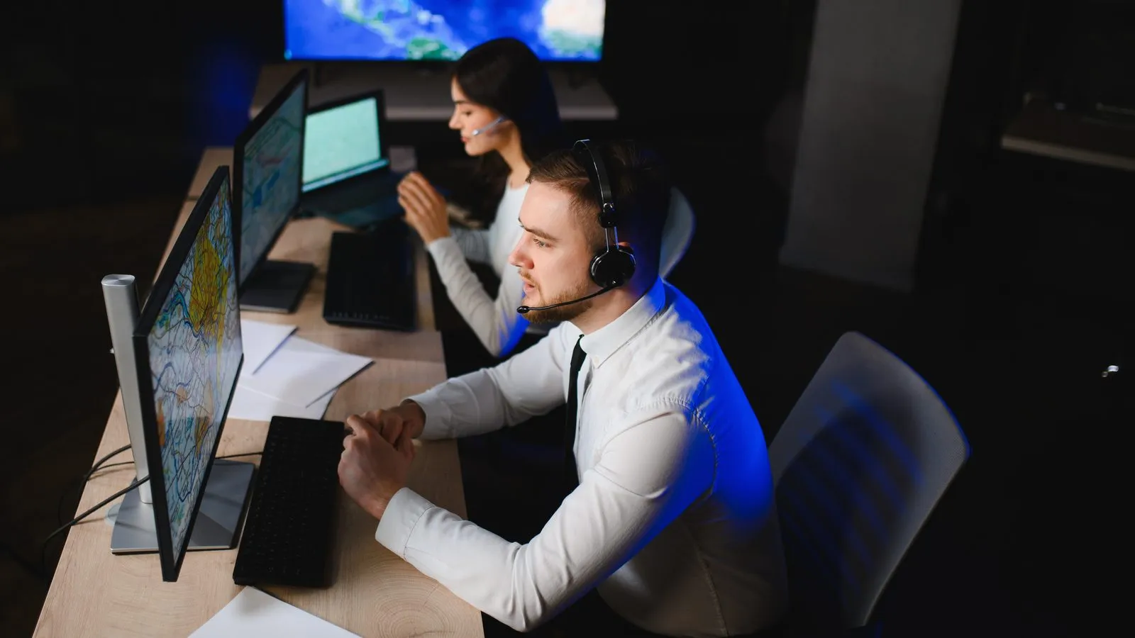 Dispatch centre team with headsets at their screens