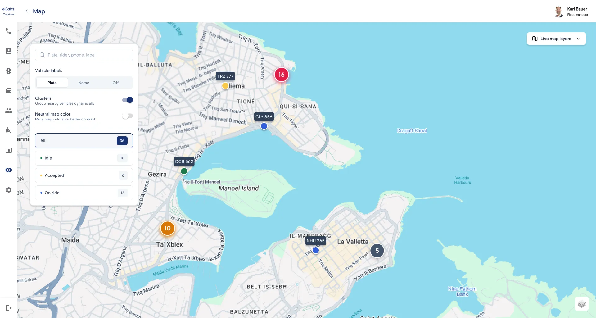 eCabs Technologies dispatch portal on a wide monitor: a live map with vehicles across several locations